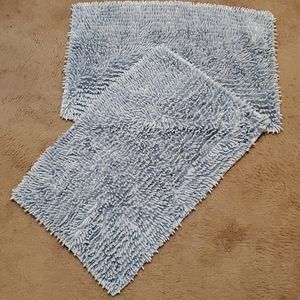 2 Aqua colored bath rugs
